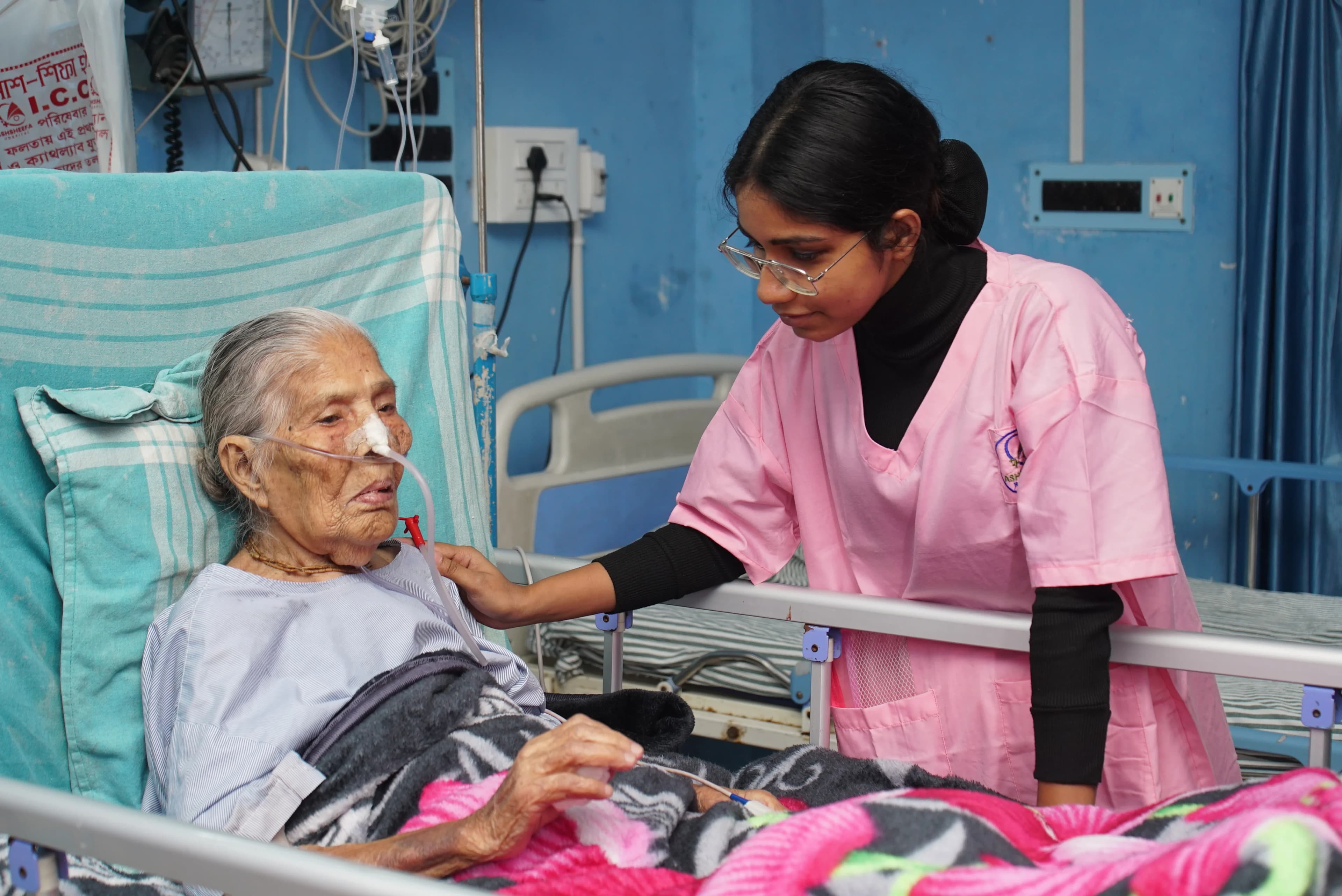 Nurse caring for elderly patient